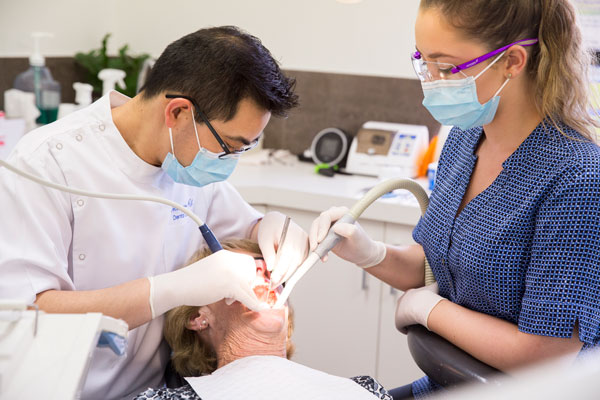 dentist-and-nurse-treating-patient