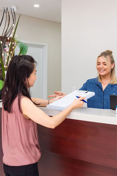 Patient and dental receptionist.