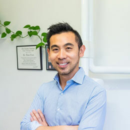 Headshot of smiling dentist Dr Tim Tran